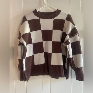 Brown and white checkered sweater